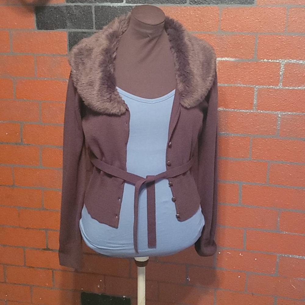 A sweater with fur collar